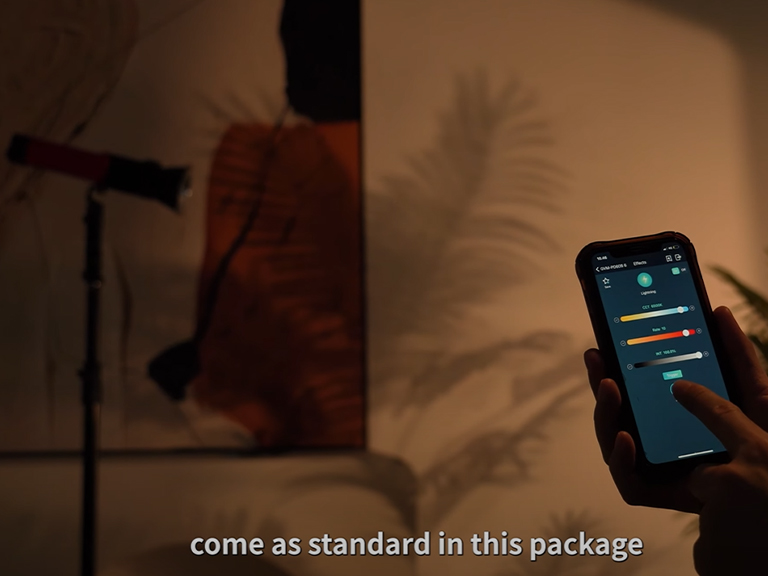 Portable Spotlight: Your Key to Mastering Hard Light Portrait Photography 4 Hand holding a smartphone showing the app interface for controlling the portable spotlight.