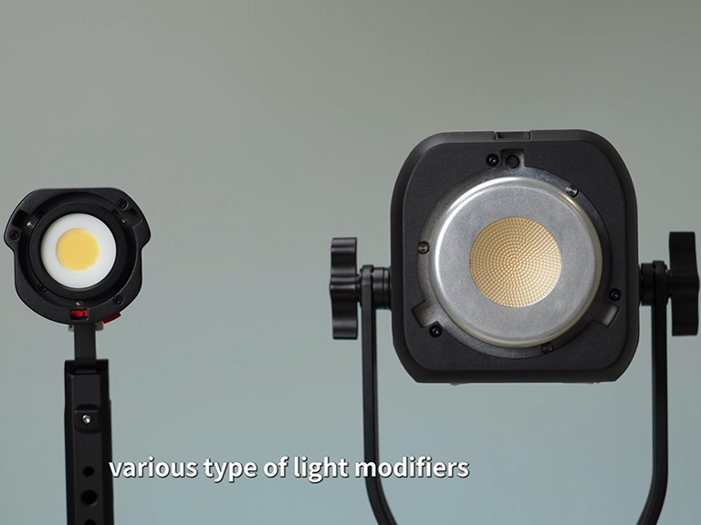 Portable Spotlight: Your Key to Mastering Hard Light Portrait Photography 6 Close-up view of the compact portable spotlight, showing its lens and body.