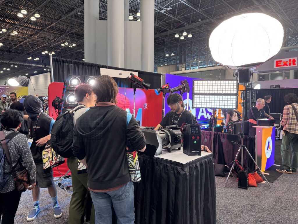 Beyond the Booth: GVM Unveils the Future of Lighting at BILD Expo 2025 4 A GVM team member explains the high-performance features of the Reign R1200B video light to an industry professional at BILD Expo 2025.