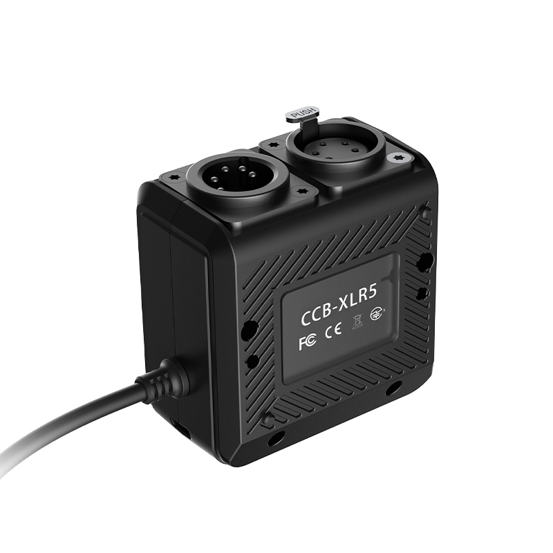 GVM SD1200B AIO 1200W Bi-Color Integrated Spotlight 10 A black DMX/CRMX control box with XLR ports and a cable, representing versatile wired and wireless control options for achieving best lighting in video recording.