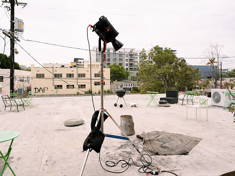 Mastering Lighting for Video Production at Movie Studio 4 Outdoor film production set with securely rigged camera and lighting for video production equipment, emphasizing safety protocols.