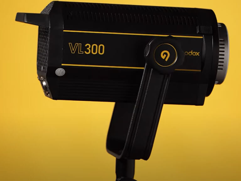 GVM SD300B-AIO: Your All-in-One 300W LED Video Light 8 The Godox VL300 300W LED video light, a popular choice for high output and value, displayed on a vibrant yellow background.