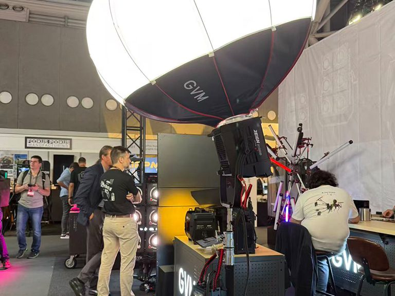 GVM Shines at IBC2025: Unlocking Creative Futures with Professional Video & Photography Lighting 3 Visitors exploring GVM professional lighting setup at IBC2025