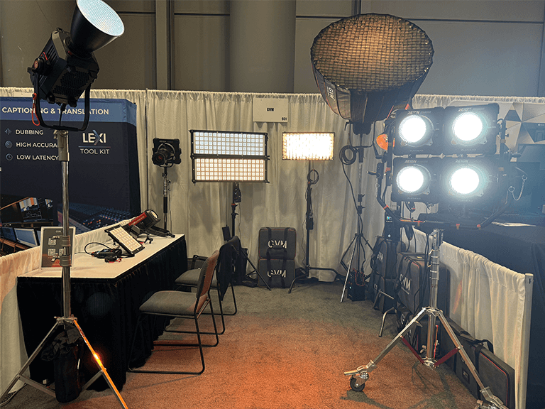 The professional film lighting product display area at the GVM stand features the Reign series and AIO series COB lights.