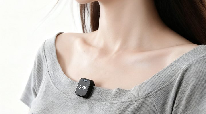 Woman wearing a compact GVM CM2 wireless lavalier microphone clipped to her collar for discreet audio recording.