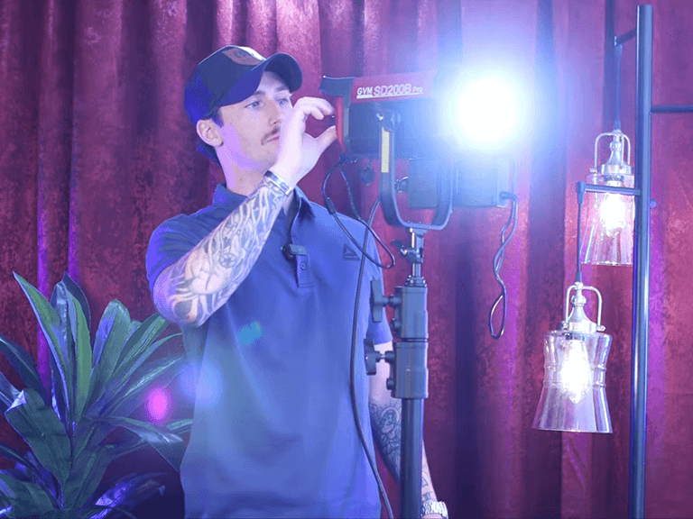 Top 10 Best Monolight LED Video Lights in 2026 1 Photographer Adjusting Studio Light