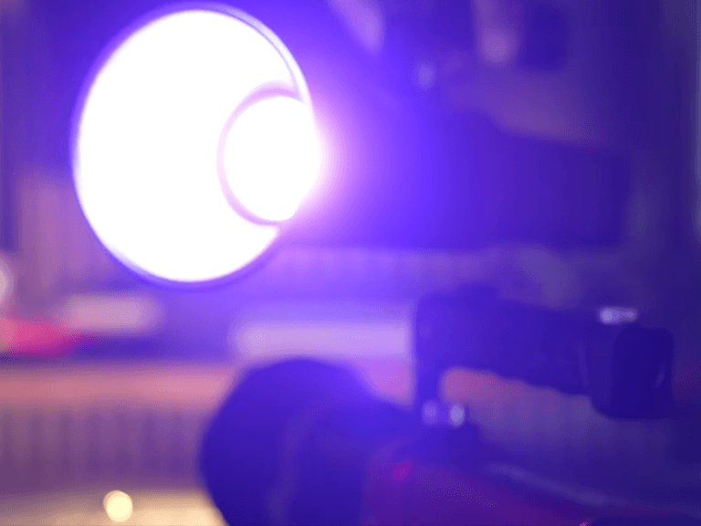 Vibrant Purple Mood Lighting: Portable RGB LED Video Light Enhancing Low-Light Vlogging Atmosphere