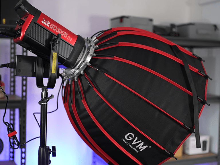 Professional studio flash with deep softbox modifier, essential equipment for three point lighting in portrait and video production.